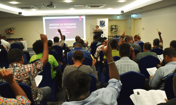 Members voting at AGM